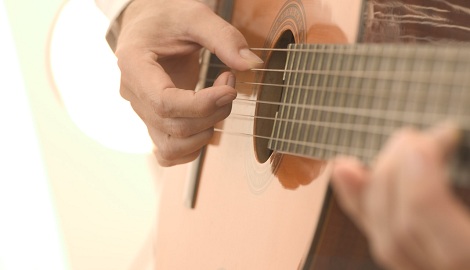 Strumming an Acoustic Guitar